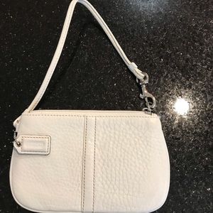 A Coach white wristlet